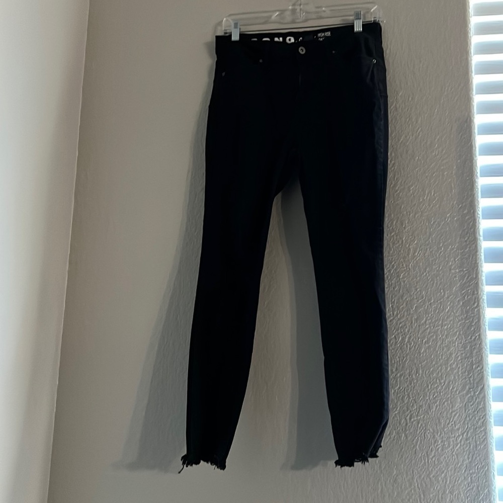 The size is 11 in juniors and black ripped skinny jeans in good condition.
